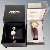 A gent's Seiko wristwatch on leather strap, boxed,