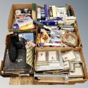 A pallet of five boxes of photograph frames, antique reference book, games,