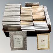 A box containing a quantity of Xenos and Fotolijst picture frames, new.