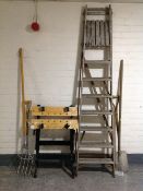 A set of folding wooden garden steps together with four garden tools and a folding work bench.