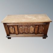 An oak linenfold blanket box.