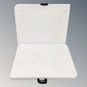 Two folding moulded plastic trestle tables