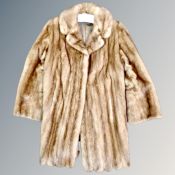 A mink fur coat together with a box of three fur hats and pair of leather gloves