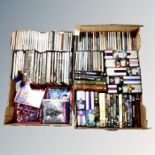 Two crates containing DVDs, CDs, Bluray box sets etc.