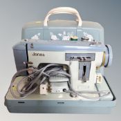A Jones electric sewing machine in case