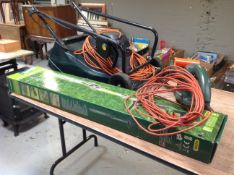 A Hayter electric lawn mower together with hedge trimmer and trimmer
