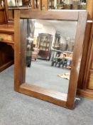 A contemporary hardwood mirror,