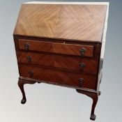 An Edwardian corner chair together with a mahogany bureau