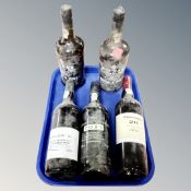 A tray of five bottles of port - Rocha's Old Tawny (2), Graham's Tawny Port aged 20 years,