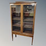 An Edwardian inlaid mahogany display cabinet