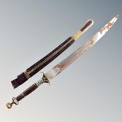 A Persian short sword in leather sheath