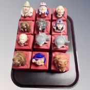 Twelve boxed Kevin Francis face pots