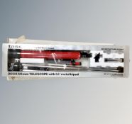 A Tasco 200 x 50 mm telescope with metal tripod, boxed.