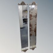 A pair of rectangular mirrored panels