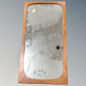 A 1970's teak framed mirror,