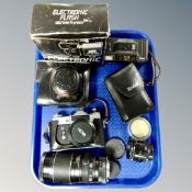 A tray containing Zenit-E camera in leather case with assorted lenses,