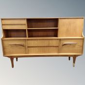 A mid century teak sideboard,