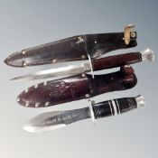 A WW II William Rogers British military knife in leather sheath together with a further hunting