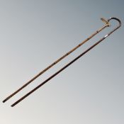 Two antique walking canes with silver mounts
