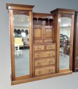 A Victorian walnut compactum sentry door wardrobe with matching mirrored dressing table