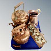 A tray of antique metal wares, copper kettles, water jug,