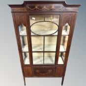 A Victorian inlaid mahogany display cabinet