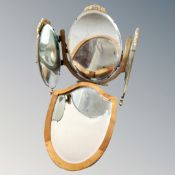 A three way triple mirror together with a shield shaped mirror