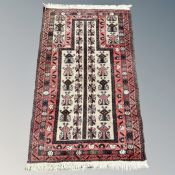 An Afghan/Caucasian prayer rug,