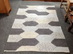 A contemporary wool rug,