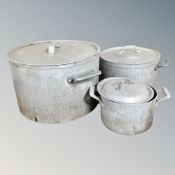 Three graduated aluminium cooking pots