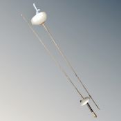 Two fencing foils together with a further ceremonial style sword