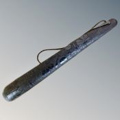 An Irish bog oak carved fishing priest