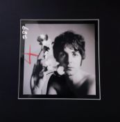 A later silver gelatin photo of Paul McCartney posing for photographer Richard Avedon in London in