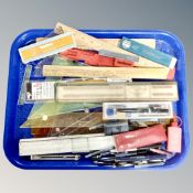 A tray of wooden rulers, drawing instruments, Faber Castell rules, pens,