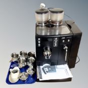A Jura of Switzerland Impressa X7-S coffee machine with instructions together with a tray