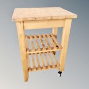 A pine butcher's block trolley