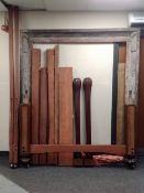 A 19th century four poster bed frame with curtains