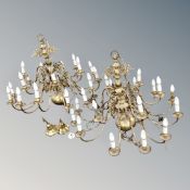 A pair of ornate eighteen branch chandeliers