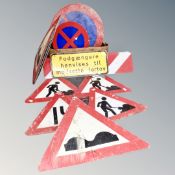 A vintage pine crate containing continental metal road signs