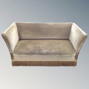 An Edwardian buttoned green dralon two seater settee