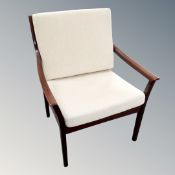 A continental armchair with cream fabric cushion