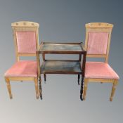 A pair of light oak dining room chairs and an oak trolley