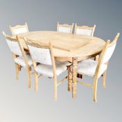 A 20th century light oak extending table with leaf and six chairs
