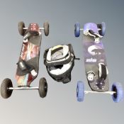 Two kite land-boards with backpack containing sail