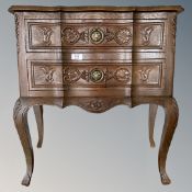 A continental carved two drawer chest