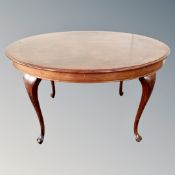 An early 20th century oval mahogany dining table