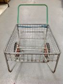 A metal two-wheel garden trolley