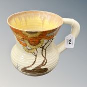 A hand painted Clarice Cliff jug, Bizzare black stamp to base, shape 635, height 18 cm.