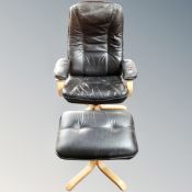 A black leather relaxer chair with footstool