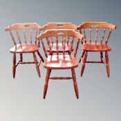 Four stained pine kitchen chairs